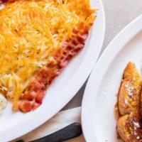 French Toast Combo · Hash browns, two pieces of bacon or sausage, two eggs, two piece of French toast