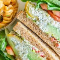 Tuna Salad Sandwich · Albacore white tuna salad (dressed lightly with mayo), lettuce, cucumbers, tomatoes, vegan b...