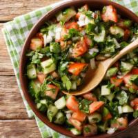 The Shirazi Salad (Mediterranean Style) · Fresh chopped cucumbers, tomatoes, onions, fresh lemon juice and olive oil dressing for exqu...