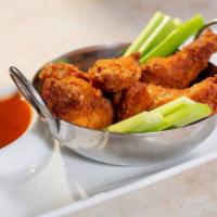 Chicken Wings · Choice of classic buffalo, bourbon BBQ, and Thai chili.