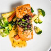 Pan-Seared Atlantic Salmon · Served with roasted vegetables.