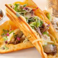 Fish Tacos · Three pieces. Halibut, cabbage slaw, chipotle dressing, corn tortillas, and pico de gallo.