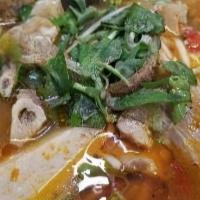 Bún Bò Huế Giò Heo / Hue’S Style Soup-Spicy (With Pork Feet) · Beef Shank, Meatloaf, Tendon, Pork Blood, Pork Leg meat w/ Pork-feet.