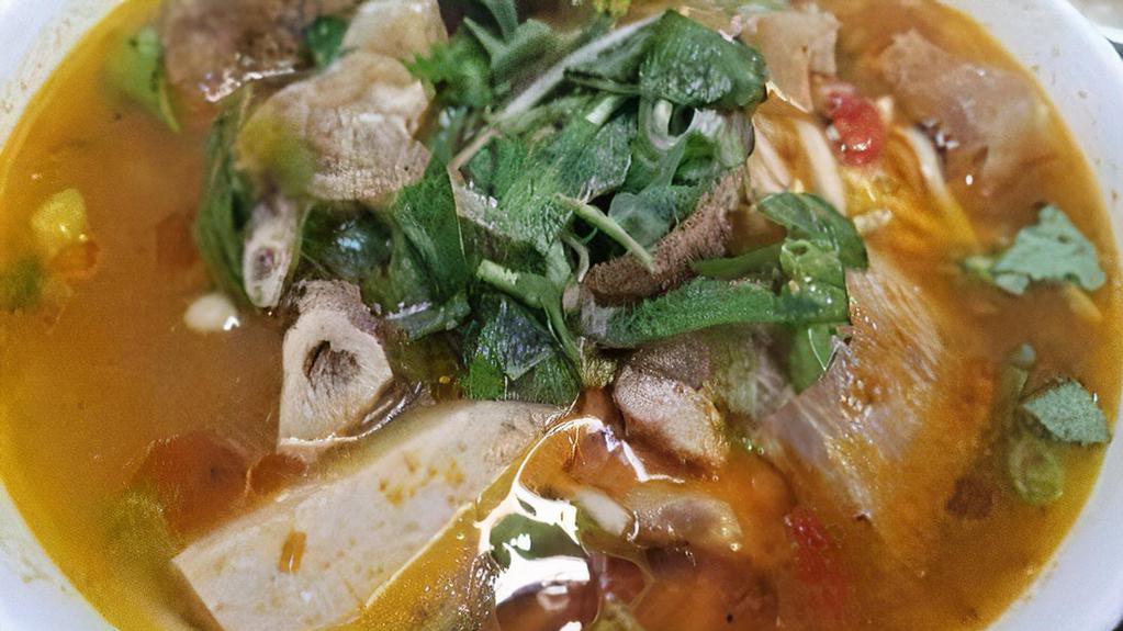 Bún Bò Huế Giò Heo / Hue’S Style Soup-Spicy (With Pork Feet) · Beef Shank, Meatloaf, Tendon, Pork Blood, Pork Leg meat w/ Pork-feet.