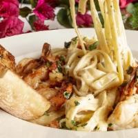 Fettuccine Alfredo · Pasta with creamy white sauce only, add shrimp, blackened chicken, or combo with shrimp, cra...