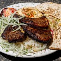 Lamb Chops · Includes 3 lamb chops. Includes rice, pita bread, hummus, grilled tomato, jalapeño, and salad.