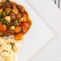 Braised Leg Of Lamb With Gnocchi · Bourbon molasses, espresso, root vegetables, tunisian BBQ tomato sauce, pecans, chermoula.
