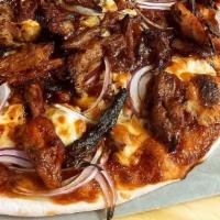 Bbq Pulled Pork Pizza · Slow smoked pork shoulder, house made BBQ sauce, red onions, and blue cheese.