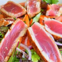 Cajun Seared Ahi Tuna Salad · Served rare. Mixed green, romaine lettuce, cucumber, tomatoes, carrots and mandarin oranges.