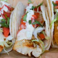 Cajun Mahi Taco · Baja style fish taco, served on corn tortillas and topped with shredded cabbage, pico de gal...