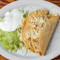 Crispy Taco · Filled with your choice of meat and topped with cheese. Served with lettuce, sour cream, & g...