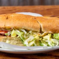 Torta · Mexican sandwich filled with your choice of meat, lettuce, sour cream, cheese, tomato, & sli...