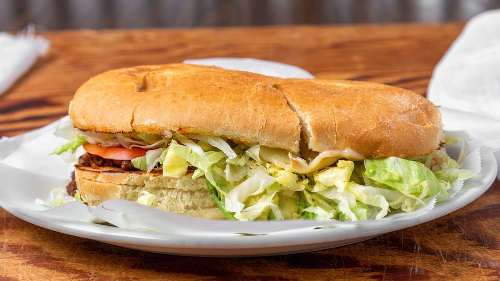 Torta · Mexican sandwich filled with your choice of meat, lettuce, sour cream, cheese, tomato, & sliced avocado.