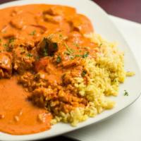 Taj Mahal Curry · Onions, mushrooms and sautéed in cream, curry and ginger. Served with rice pilaf.