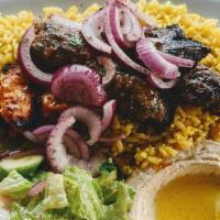 Mixed Grill Plate · For one person. Kafta, chicken and beef kebobs served with rice, hummus house salad, garlic ...