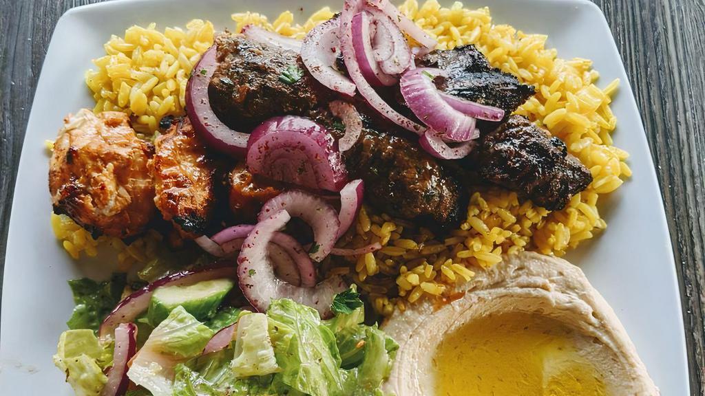 Mixed Grill Plate · For one person. Kafta, chicken and beef kebobs served with rice, hummus house salad, garlic aioli, grilled veg and pita bread.