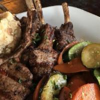 Lamb Chops · Four French cut lamb chops marinated and grilled over an open flames. Served with rice pilaf...
