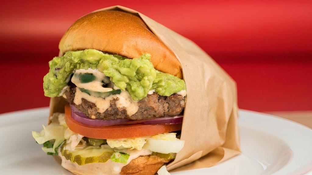 El Caliente · El Caliente Burger includes: . 100% fresh ground beef patty. Grilled Jalapenos. Fresh Guacamole. Spicy Chipotle Dressing. red onions, . lettuce,. tomato, . pickles, . (lettuce wrap available upon request).