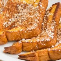 French Toast · 6 Pieces French Toast topped with Cinnamon and Powdered Sugar. . Served with a Syrup and But...