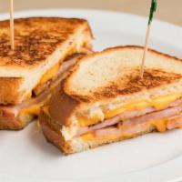 Grilled Ham & Cheese · Grilled Ham & Cheese includes: . Grilled Sourdough Toast,. Ham Slices,. 2 Slices American Ch...
