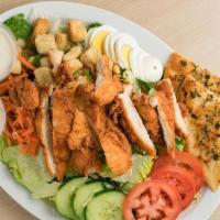 Crispy Chicken Salad · Crispy Chicken Salad includes: . Freshly Breaded Chicken Tenders,. Romaine and Iceberg Lettu...