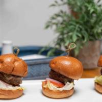 Sliders · Three Beef Patties grilled to perfection in a mini brioche bun