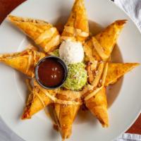 Chicken Taquitos · Deep fried flour tortilla filled with chicken, cotija cheese and aioli sauce, served with gu...