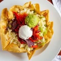 Taco Salad Cazuela · A bowl-shaped flour tortilla deep-fried and filled with picadillo, ground beef or chicken, r...