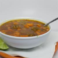 Albondigas Soup · Delicious Mexican soup made with homemade minted pork meatballs and seasonal vegetables in a...