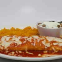 Burrito A La Diabla · Your choice of chicken, ground beef or picadillo stuffed into a flour tortilla. Topped with ...