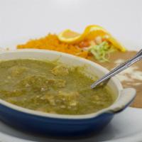 Chile Verde · Chunks of pork cooked tenderly with spices in it's own green tomatillo sauce. Garnished with...