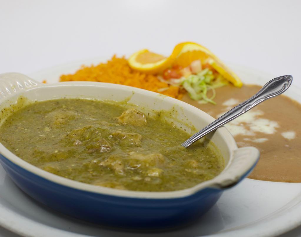 Chile Verde · Chunks of pork cooked tenderly with spices in it's own green tomatillo sauce. Garnished with lettuce and tomatoes.