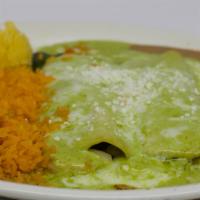 Veggie Enchiladas · Two corn tortillas stuffed with broccoli, cauliflower, onions, zucchini, and bell peppers. T...