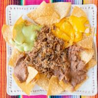 Nachos With Meat, Beans, Cheese, And Guacamole · Thin style chips with nacho cheese, daily made beans and fresh guacamole with HASS avocados....