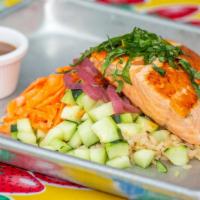 Wild Salmon Bowl · Salmon, brown rice, cucumbers, sweet onions, carrots, toasted almonds, fresh mint, basil, an...