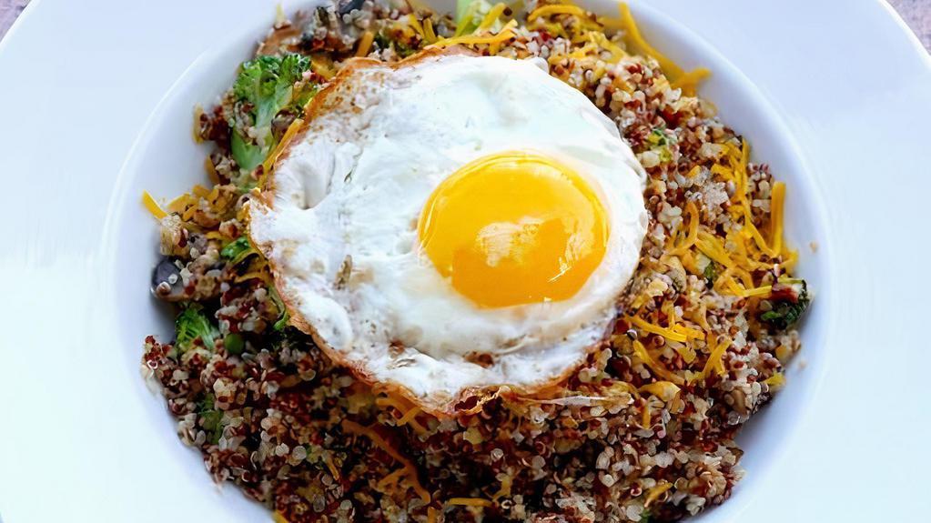 Nicole'S Quinoa Bowl · Quinoa, with sautéed broccoli, mushrooms, melted Cheddar cheese. Topped with a sunny side up egg.