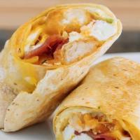 La Neta Breakfast Burrito · Eggs over easy, tater tots, avocado, crema, Cheddar cheese, and salsa roja on the side with ...