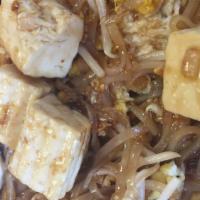 Tofu Pad Thai · Stir-fried rice noodles with tofu, scallions, bean sprouts, scrambled egg, and crushed peanu...