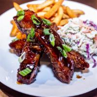 Asian Sticky Ribs · 1 pound of slow cooked St. Louis style baby back ribs tossed in our homemade sticky sauce, s...