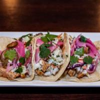 The Taco Town · Three tacos with your choice of one meat (pulled pork, blacken chicken or barbacoa) topped w...