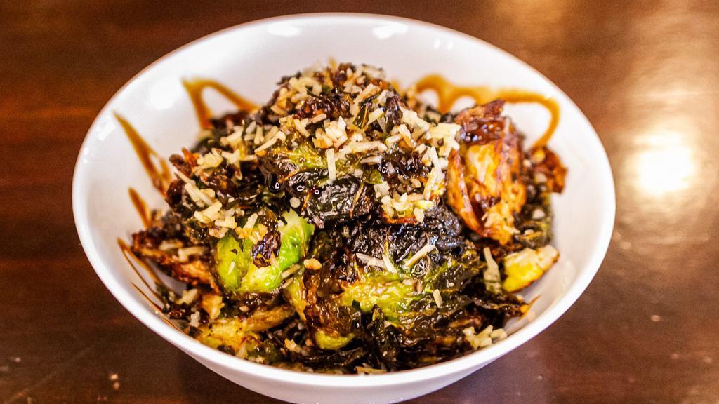 Balsamic Brussels Sprouts · Crispy fried brussels sprouts with garlic and parmesan cheese and a balsamic reduction.