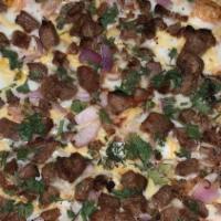 Bbq Chicken Pizza · Mesquite grilled chicken breast, smoked gouda and mozzarella, red onions, cilantro and our s...