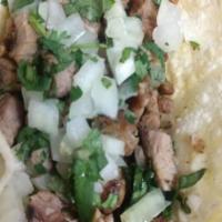 3 Carne Asada, Pork Carnitas Or Chicken Tacos · 