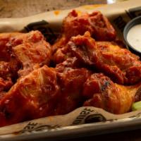 Roadhouse Wings · Our signature wings fried to perfection in your choice of garlic parmesan, buffalo, cajun dr...