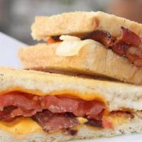 Grown Up Grilled Cheese · A generous blend of Jack, Cheddar, and American cheese topped with crisp bacon and juicy tom...