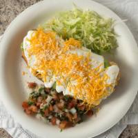 Chimichanga · with beans and cheese inside
on top guacamole,sourcream and cheese
on the side of the chimic...