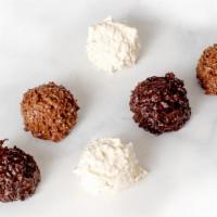 Haystack · Coconut clusters covered in milk, white, or dark chocolate