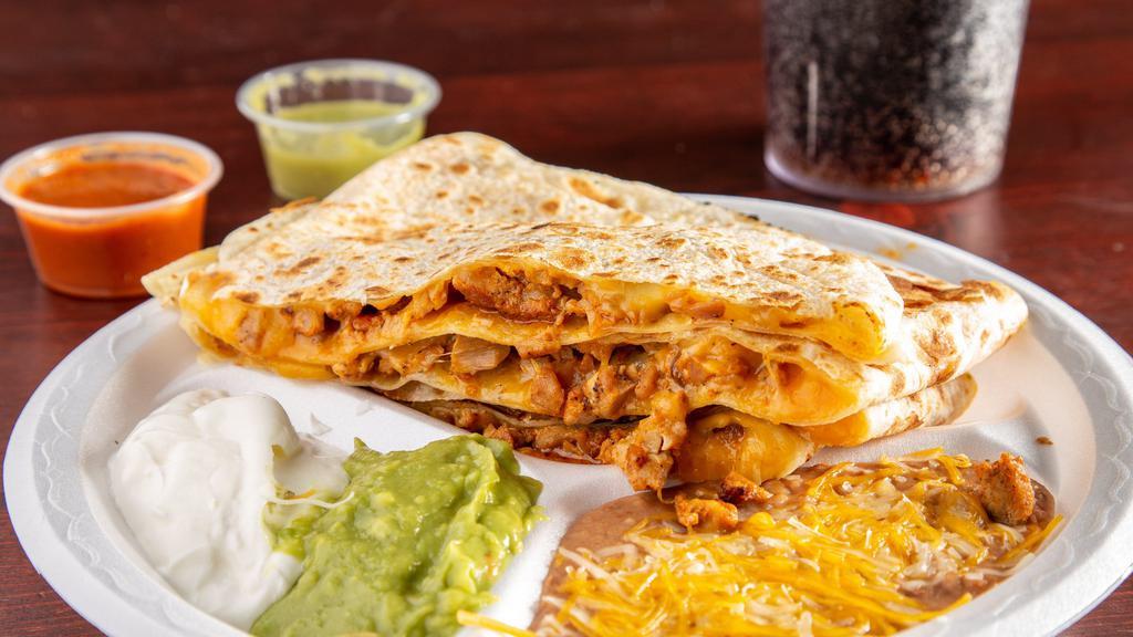 Chicken Super Quesadilla · With Guacamole, sour cream, and beans on the side.