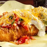 Carne Asada Chimichangas · Served with beans, cheese, sour cream, lettuce, and guacamole.