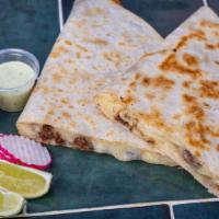 Quesadillas · Choice of meat, cheese, cilantro, onion, hot or mild sauce.